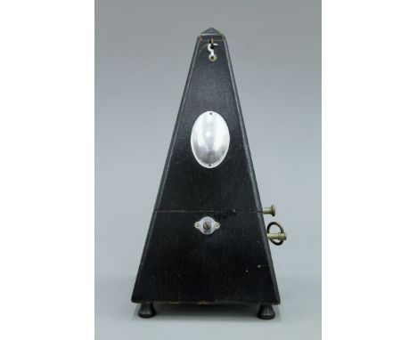 A vintage metronome. 23 cm high.