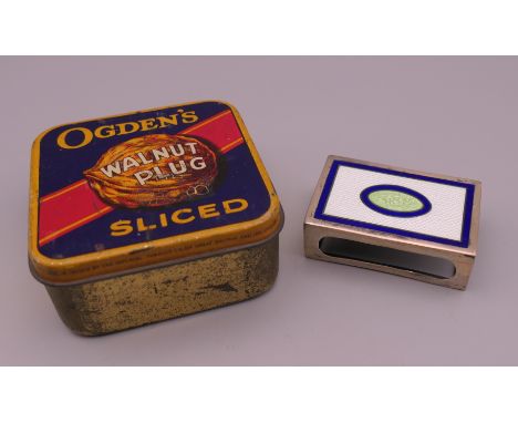 An Ogden's walnut plug tin and an enamel decorated silver match box cover. The latter 4.5 cm wide.