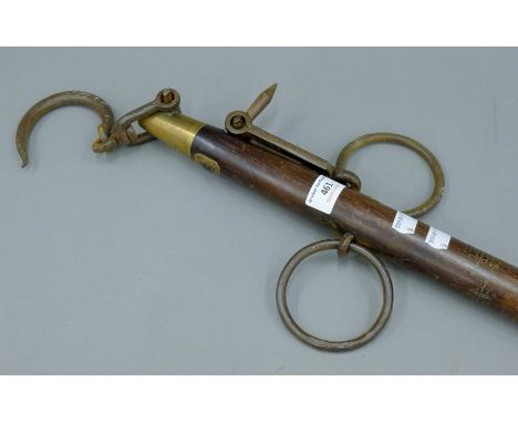 A 19th century Japanese brass and iron mounted wooden weighing scale. 163 cm long.