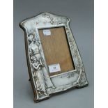 An Art Nouveau silver plated photograph frame,