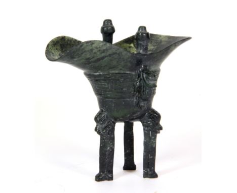 A lovely Chinese Archaic form carved spinach jade wine cup, H. 12cm.