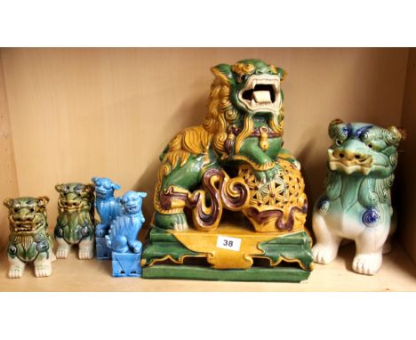 A group of Chinese ceramic lion dog figures, H. 36cm (largest).