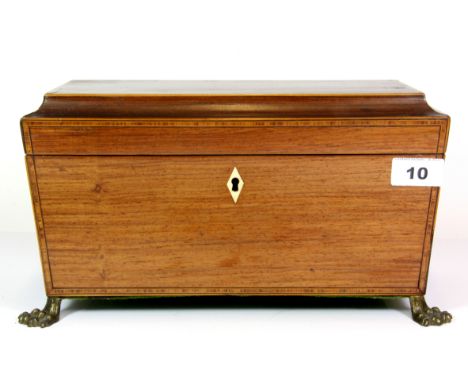 A Regency inlaid mahogany tea caddy with lions paw feet and lion head handles, 32 x 17 x 17cm.