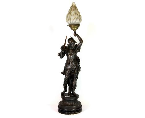 An early 20th century spelter figural table lamp with glass flame shade, H. 88cm.