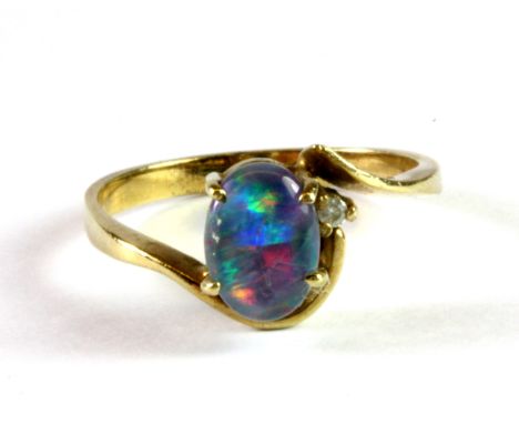 A 9ct yellow gold (stamped 375) opal doublet and diamond set ring, (N).