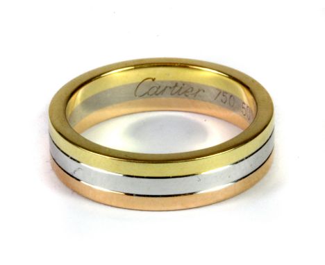 A Cartier 18ct gold tri-colour wedding band, (K).