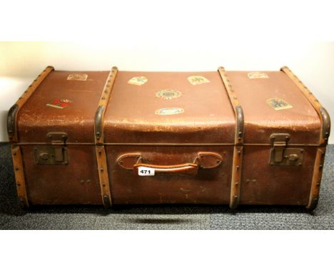 A vintage cabin trunk style suitcase with old German travel stickers, 75 x 45cm.