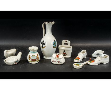 Collection of Souvenir Porcelain, comprising a Goss See of Norwich jug, Willow Art Morecambe shoes, Goss model lamp Altrincha