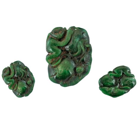 A Dark Green Jade Carving depicting a stylised monkey and Salamander. Measures 2 by 1.5 inches.