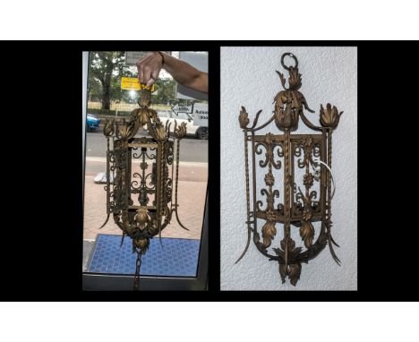 French Wrought Iron and Tin Lantern, made in the Baroque style, c1930s, with a matching wall light; lantern 27 inches (67.5cm