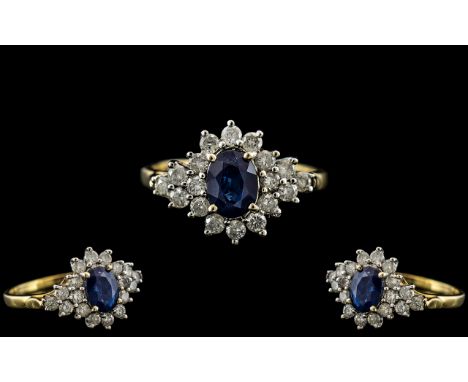 18ct Gold - Attractive Diamond and Sapphire Set Dress Ring. The Central Sapphire Surrounded by Diamonds of Excellent Colour /