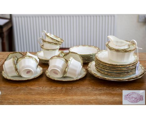 Tea Service by Alfred Pearce &amp; Co of London, comprising eleven tea cups, saucers and side plates; two sandwich/cake plate