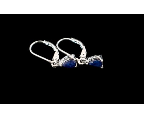 Sapphire Solitaire Drop Earrings, a timeless design with pear cut solitaire blue sapphires suspended from secure lever back f