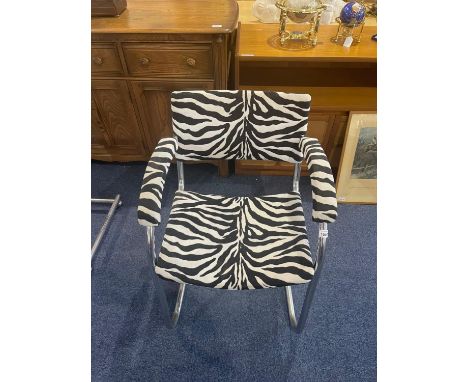 A Pel Chrome Cantilever Baushause Style Armchair.  Covered in zebra print fabric.