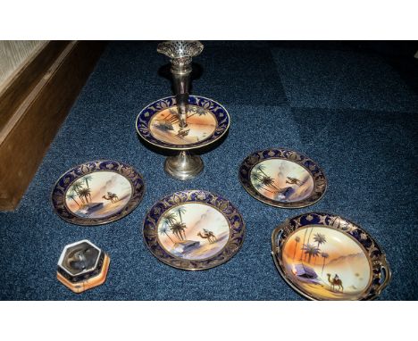 A Collection of Noritake to include, a cake stand with a epergne , three plates, teapot and a preserve jar in painted desert 