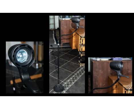 A Modern Adjustable Standard Lamp in black finish, approx 5 feet tall.