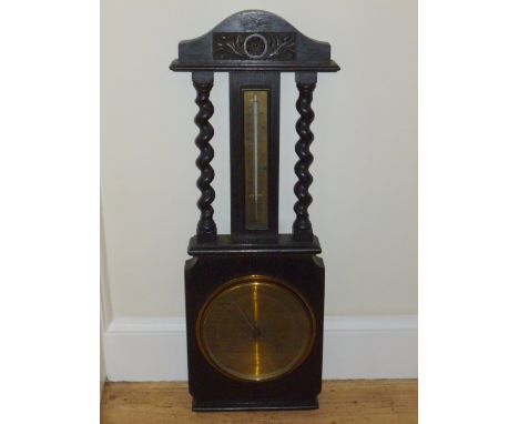 EDWARDIAN OAK ANEROID BAROMETER WITH A BRASS CIRCULAR DIAL INSCRIBED "WM BRAITHWAITE, F.I.O., BEST OPTICIAN, DARTMOUTH" WITH 