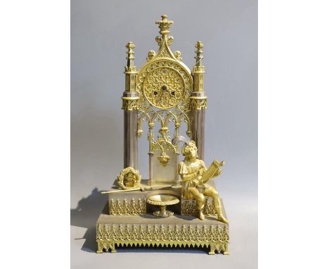 A late 19th century French silvered and gilt metal architectural 8 day mantel clock cast with a seated cavalier with lyre. He