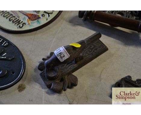 A door knocker in the form of a bird 