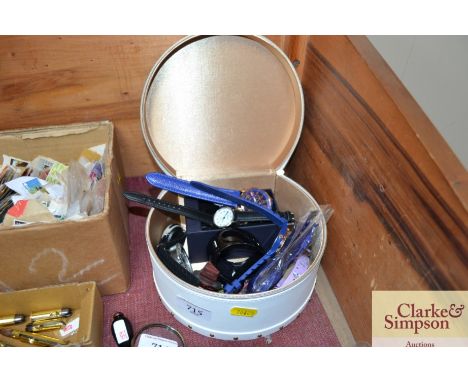 A trinket box and contents with various wrist watches