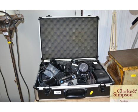 A box containing Pentax ME Super camera, Pentax ME camera, Kodak Instamatic camera and various lenses etc.