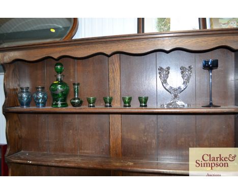 A Wedgwood style glass candle stand; a glass two branch candelabra; a collection of coloured glassware to include a decanter 