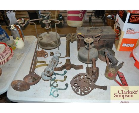 A Bailey pump; a paraffin stove; an ornate door knocker; a trivet; flat iron; blow torches; a vintage metal storage etc.
