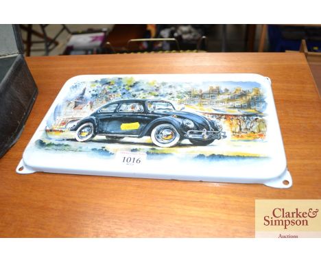 A enamel sign depicting a VW Beetle