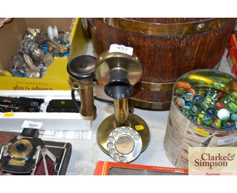 A brass rotary dial telephone