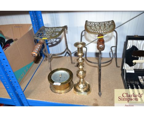 A brass ships type barometer, brass candlestick and two brass and iron trivets