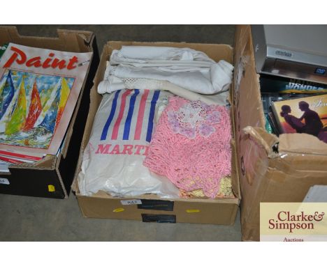 A box of vintage linen including antimacassars and table linen