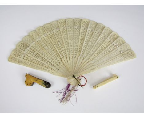 A 19th Century bone brisé fan, with reticulated sticks, together with a Stanhope ear pick, with views of Scarborough, and a f