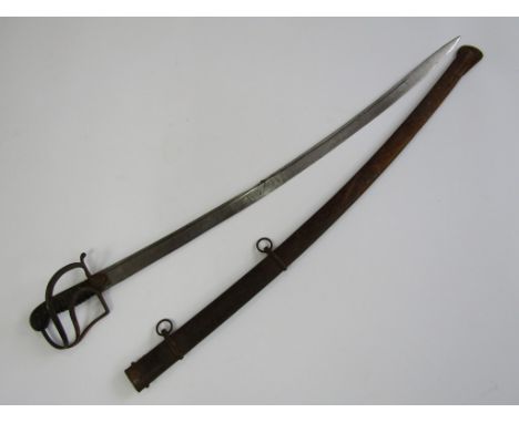 A late 18th / early 19th Century light cavalry trooper's sabre, having stirrup hilt with two carved side guard, single-fuller