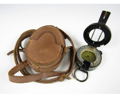 A 1945 British Army Mk III prismatic marching compass in leather case