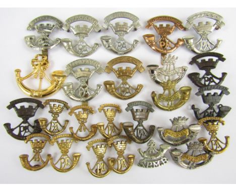 A quantity of Somerset Light infantry metal insignia