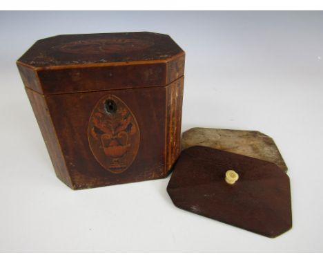 A George III inlaid mahogany tea caddy, of rectangular section with canted corners, to the lid an oval floral marquetry medal
