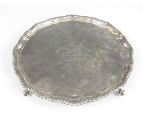 A George VI silver card tray, with Chippendale border and three volute feet, with presentation engraving from the Royal Belfa