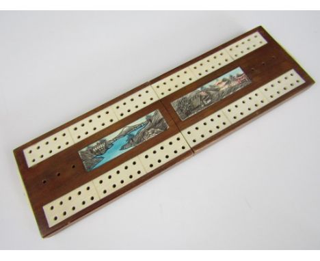 A Japanese carved ivory and hardwood cribbage board, circa 1930s, 19 cm long