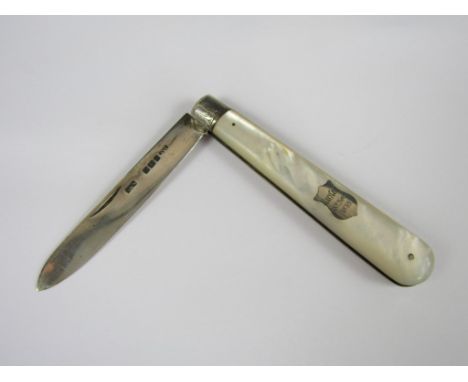 A Victorian silver fruit knife with mother of pearl grip scales, the latter with shield shaped engraved cartouche, Sheffield,