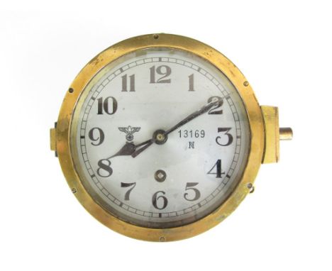 A Second World War German Kriegsmarine bulkhead clock, by family tradition taken from a captured U-Boat
