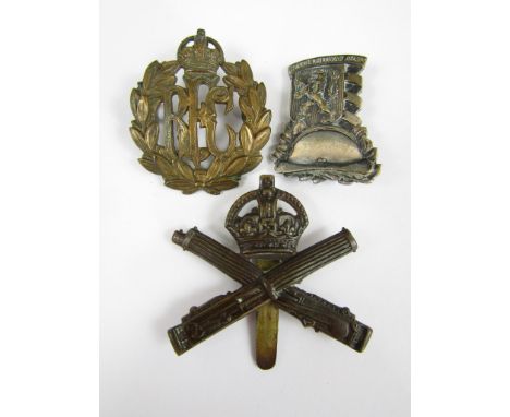 A Machine Gun Corps cap badge, a RFC cap badge and a Free Czechoslovak Army badge