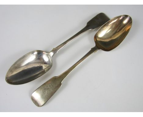 A pair of George IV Irish silver table spoons, of fiddle rat-tail pattern with an armorial crest to the terminals, Joshua Buc