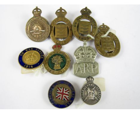 A small quantity of First and Second World War 'mufti' badges, and a Women's Land Army cap badge (8)