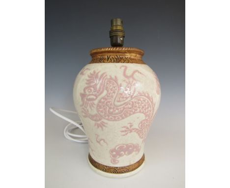 A Charlotte Rhead for Bursley Ware table lamp, of inverted baluster form, decorated with a pink tube-lined chinoiserie design