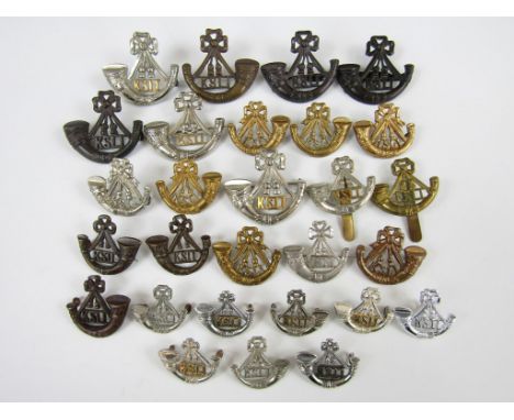 A quantity of King's Shropshire Light Infantry silver and other metal insignia