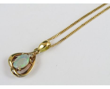 An opal and diamond pendant necklace, the oval cabochon of approximately 7mm, claw set beneath a single diamond brilliant and