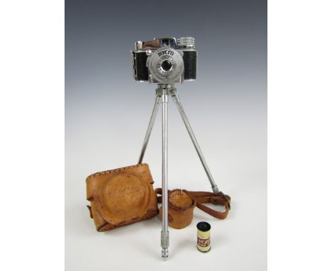 A Mycro IIIA miniature camera, with leather case, tripod and film roll