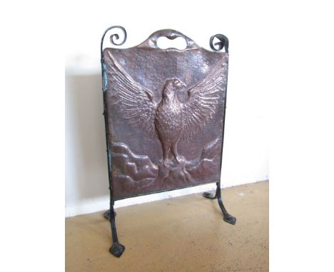 An Arts and Crafts influenced wrought iron and copper fire screen, late 19th / early 20th Century 