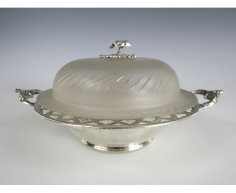 A Victorian silver and cut glass butter dish, with glass liner, domed cover and cast floral finial, Thomas White, Birmingham,