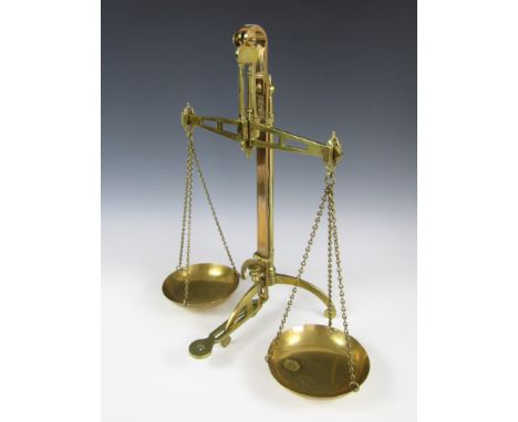 A 19th Century set of brass counter top beam scales by Degrave & Co of London, 55 cm 